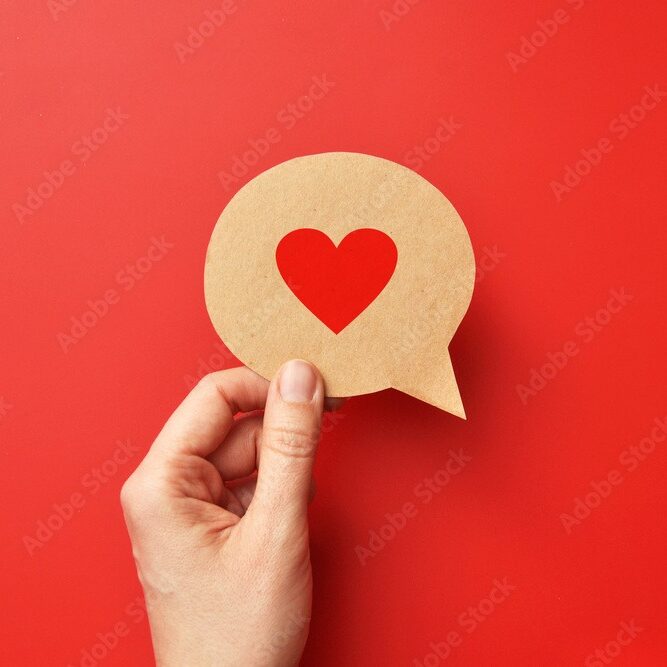 Red paper heart on a conversational cloud. Symbol of love and conversation and declaration of love